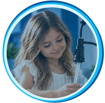 Young girl filling glass with water from pump dispenser in kitchen.